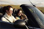 Women driving in rural landscape