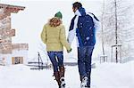 Couple walking together in snow