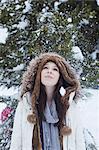 Teenage girl standing in snow