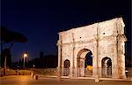 Arch of Constantine lit up at night