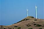 Windmills overlooking rural landscape