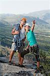 Climbers surveying mountaintop