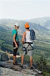 Climbers overlooking rural valley