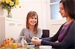 Mother and daughter having breakfast