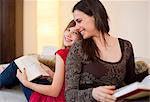 Mother and daughter reading separately