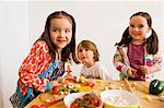 Children cooking together in kitchen