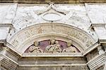 Ornate relief carvings on building wall