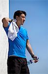 Athlete wiping sweat outdoors