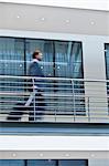 Blurred view of businessman on balcony