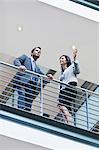 Business people talking on balcony