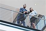 Business people talking on balcony