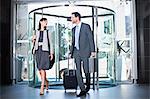 Business people in revolving door