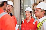 Workers walking at oil refinery