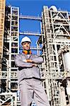 Worker standing at oil refinery