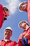 Smiling workers talking outdoors