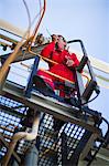 Worker using walkie talkie on site