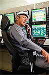 Man working in security control room