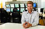 Man working in security control room