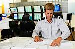 Man working in security control room