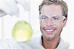 Scientist examining liquid in lab