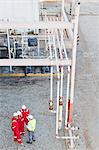 Workers talking at chemical plant