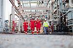 Workers walking at chemical plant