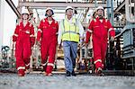 Workers walking at chemical plant