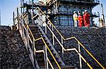 Workers talking at chemical plant