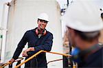 Workers talking at chemical plant