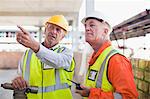 Workers talking at construction site