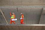 Workers walking at construction site