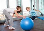 Mother and son playing in gym