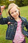 Girl playing with chestnut on string