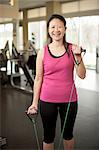 Older woman stretching in gym