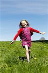 Smiling girl playing in field