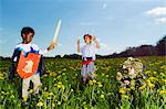 Boys playing dress up outdoors