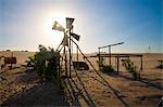 Dilapidated windmill in desert