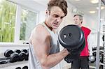 Man lifting weights in gym