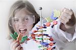 Girl breaking molecular model