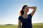 Smiling woman standing in field