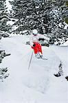 Skier jumping on snowy slope