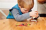 Boy decorating gingerbread cookie