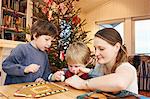 Family decorating gingerbread house