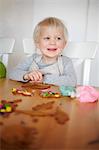 Boy decorating gingerbread cookies