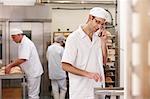 Chef talking on phone in kitchen