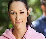 Young woman in pink hoodie