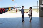 Student pilot shaking hand of woman