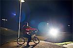 BMX-cyclist riding at night time