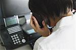 Japanese young businesswoman depressed at her office desk