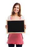 Beautiful blonde woman holding  a chalkboard, isolated over white background
